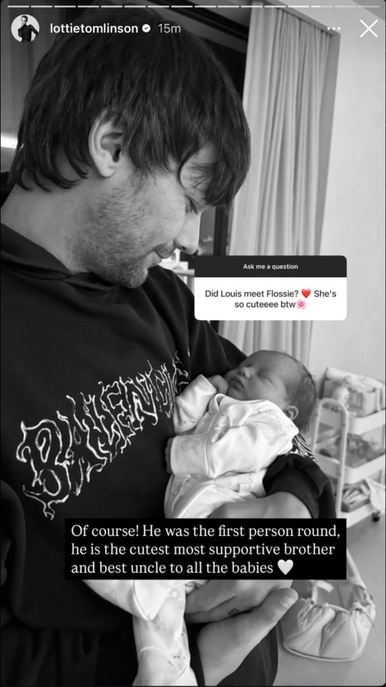 Louis Tomlinson holding his niece Flossie