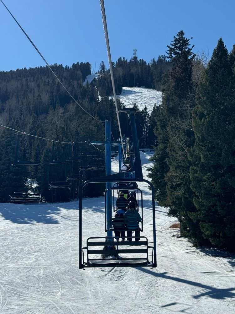 A ski lift, photographed from the lift 