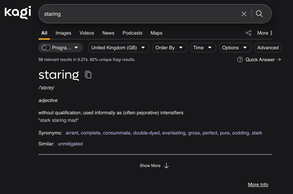 A Kagi search for the word "staring". The definition given is: adjective:
without qualification; used informally as (often pejorative) intensifiers
"stark staring mad"