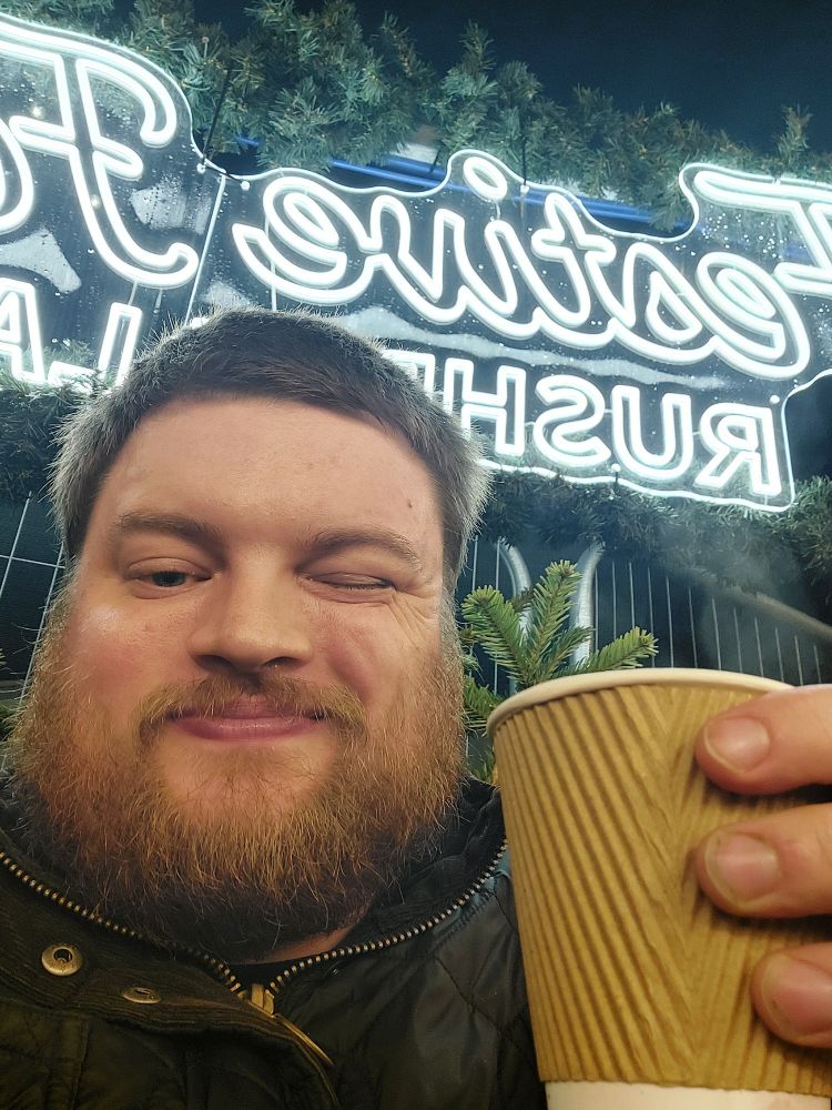 Some idiot with some mulled wine, winking at the camera. He's not even an Arsenal fan.