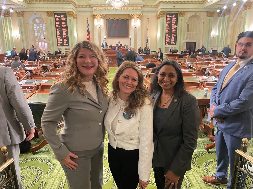 A picture of three women: Assemblymember Boerner, Asm. Dr. Darshana Patel, and City of Carlsbad Councilmember Teresa Acosta on the Assembly Floor.