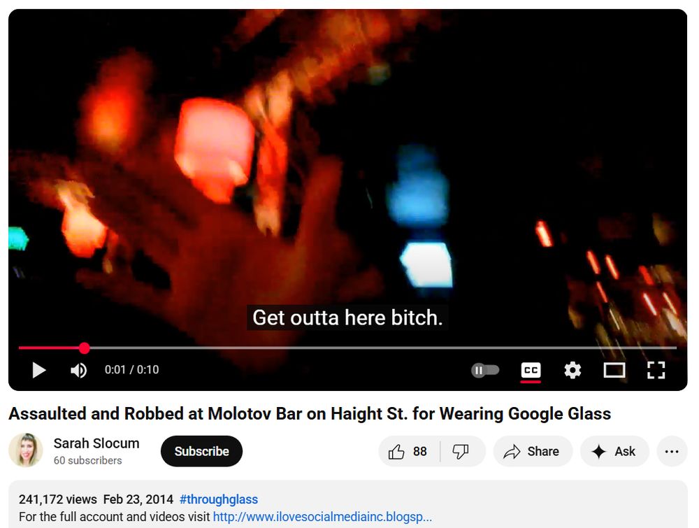 screengrab of a youtube video from 2014 titled "assaulted and robbed at molotov bar on haight st for wearing google glass" with an outstretched hand and the caption "get outta here bitch."