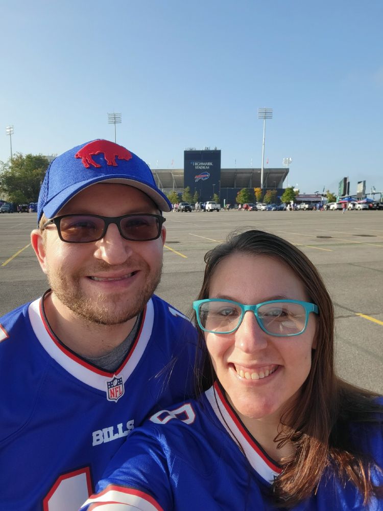 Two people tailgating at a Buffalo Bills game