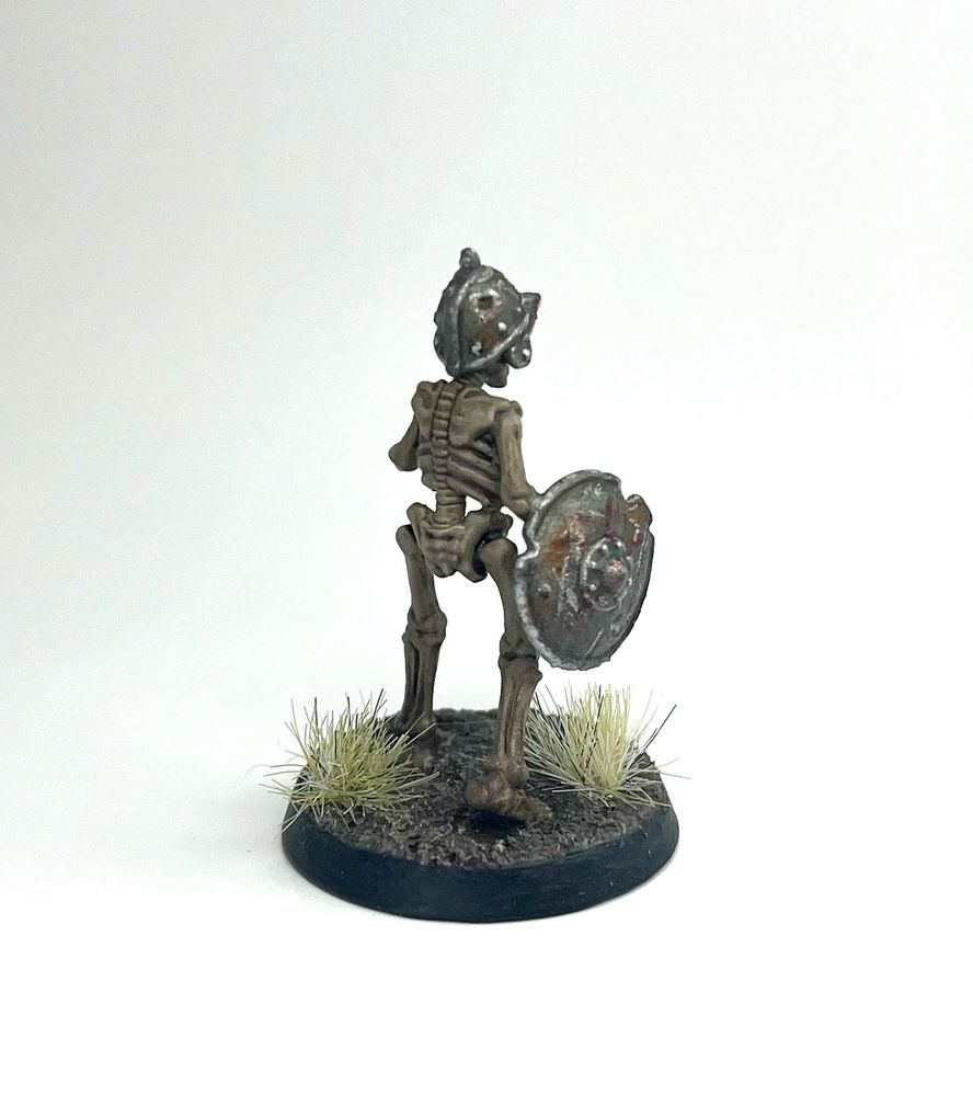 The same axe-wielding skeleton miniature from the back. Not much going on in the trunk on this one.
