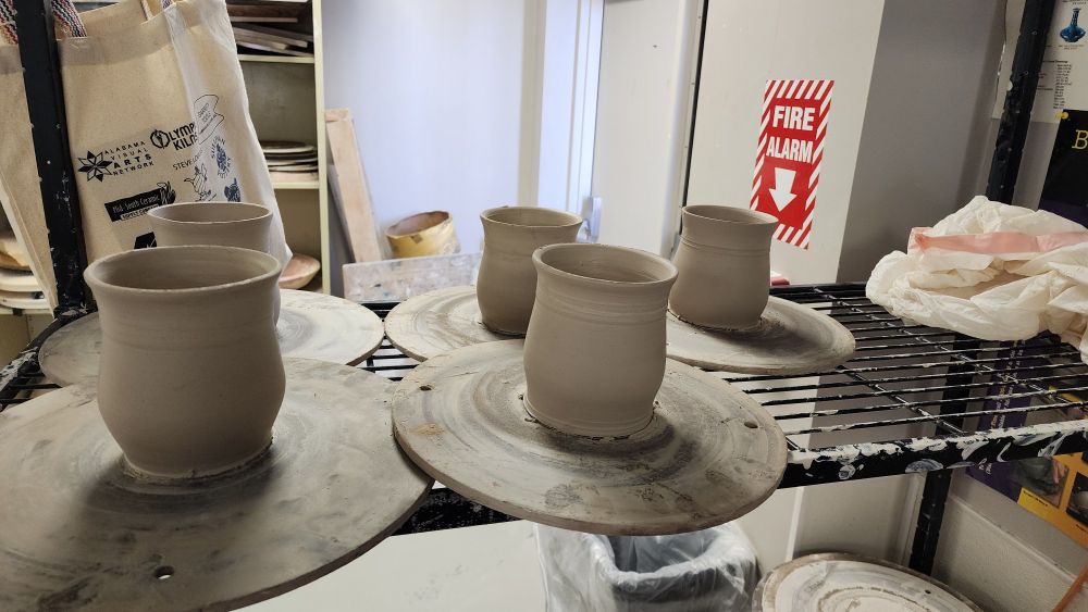 5 unfired mugs without the handle