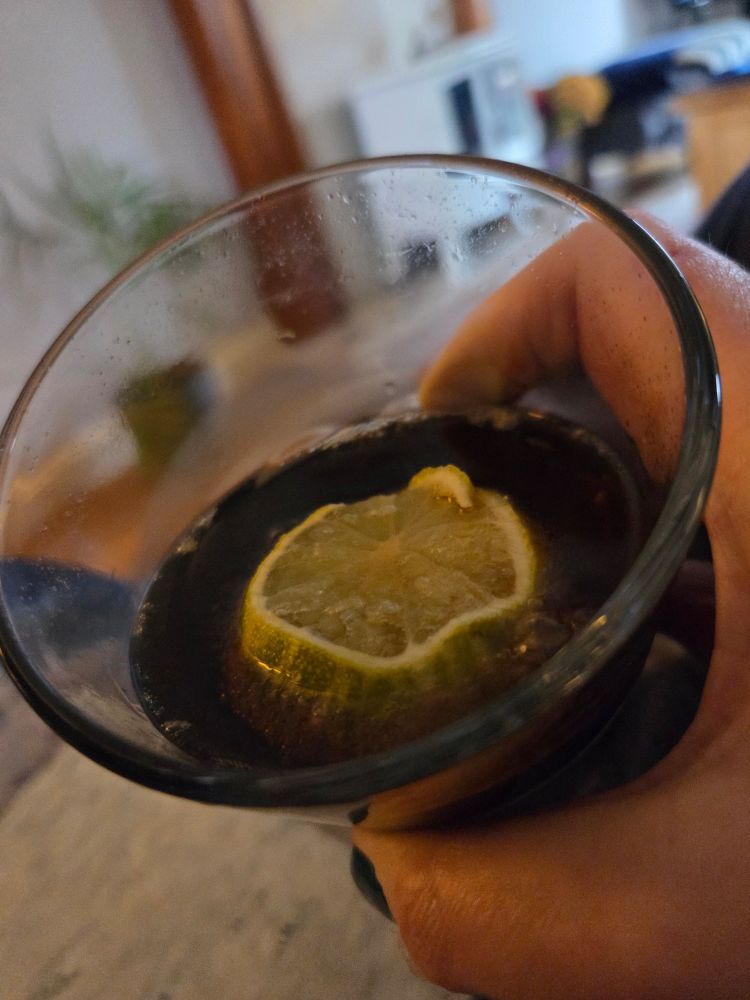 Coke in a glass with lime. 