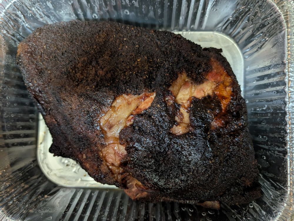 Smoked and rested pork butt ready to be shredded 