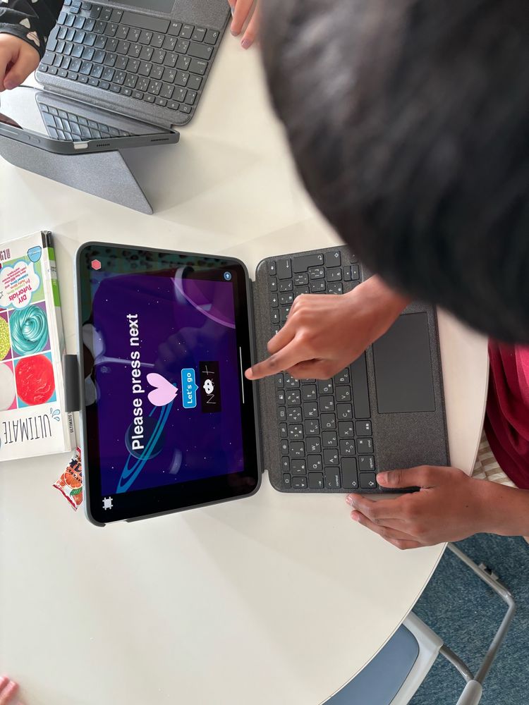 Student tests love story program in ScratchJr. 