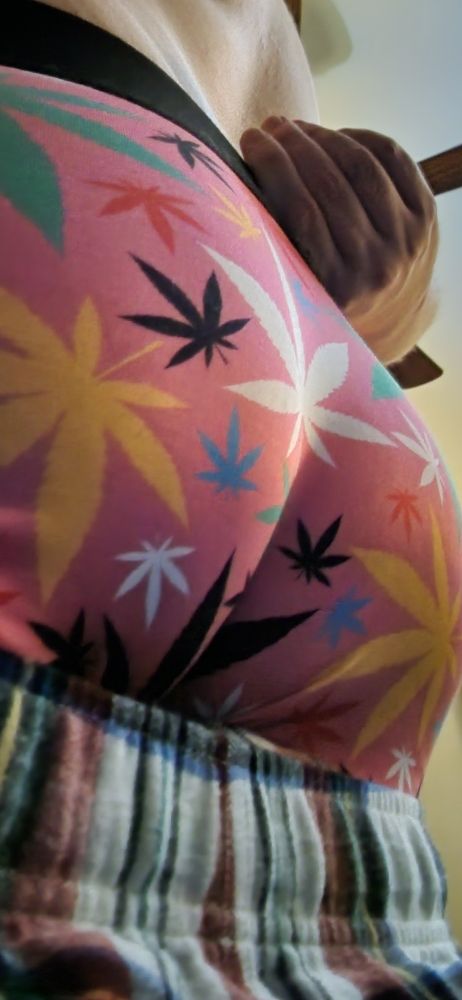 It's my butt, in bubblegum pink underwear with colorful weed leaves, tugged upward to hug the shape of my ass