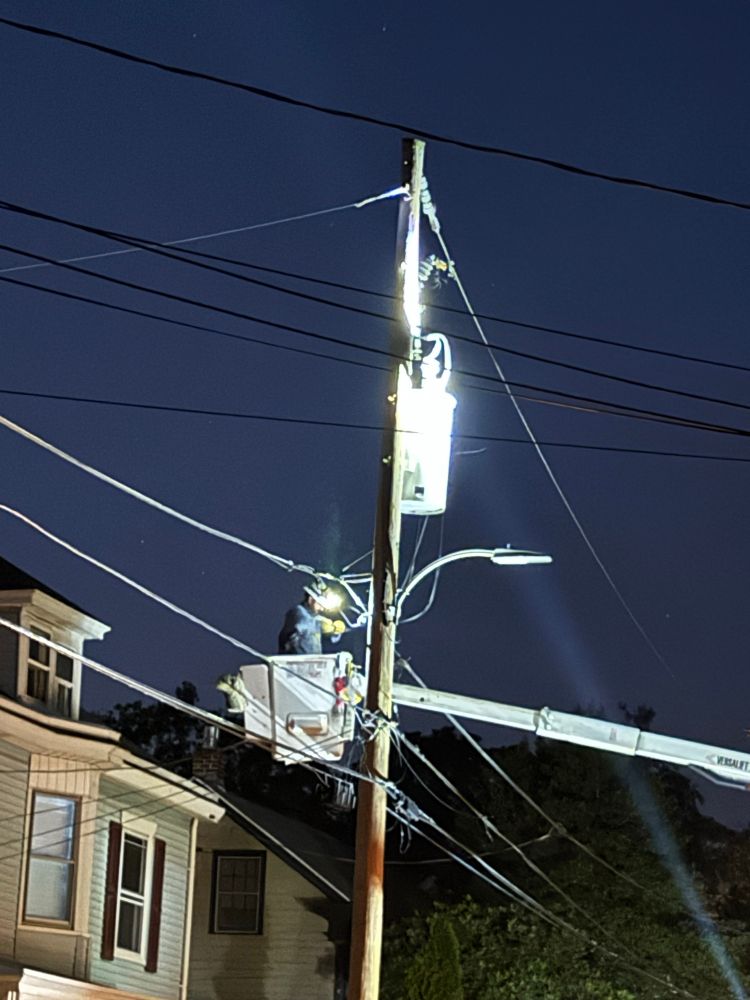 Photo of a PECO line worker clearing what was previously a squirrel 