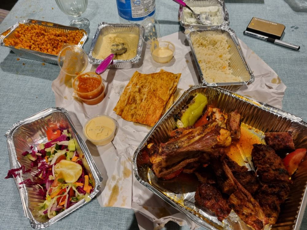 Food containers still laden with Tirkish food.