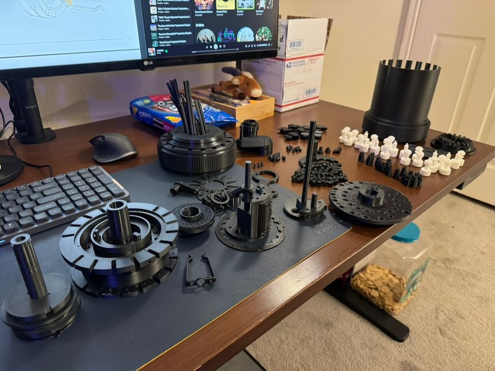 A table full of Curta calculator parts pre-assembly.