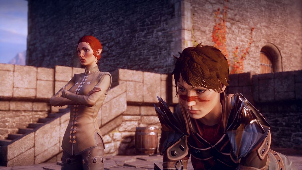 The Inquisitor and Hawke have a heart to heart atop a wall at Skyhold in Dragon Age: Inquisition