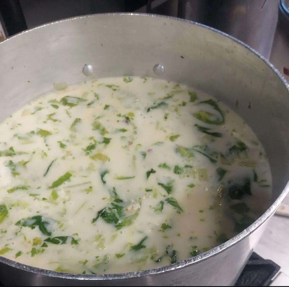 Panel B: we see a big pot, which contains broth with chunks of the lettuce from (A). 