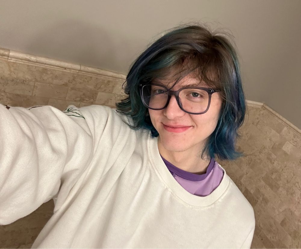 A selfie of me with blue and purple dyed into my hair