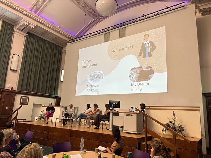 Dr Nicole Gridley presenting a slide which shows her 3 dream jobs before she started in academia.