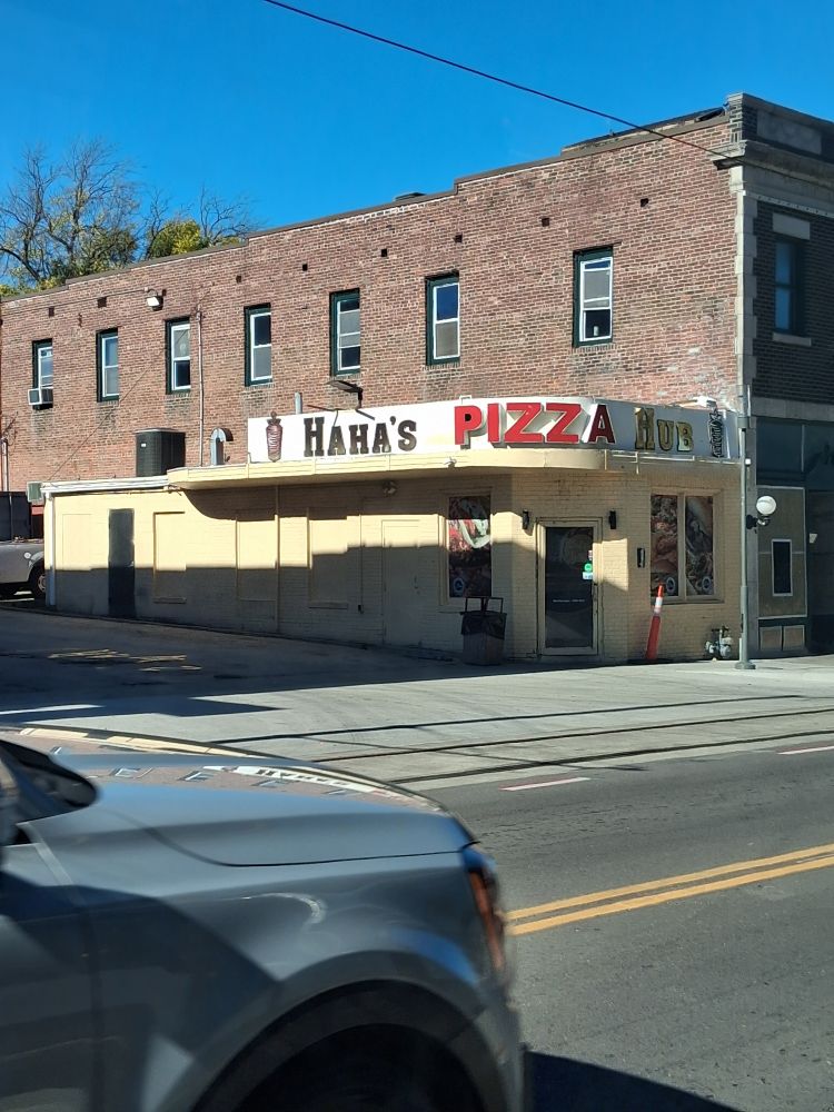 Small pizzeria named Haha's Pizza Hub, on Main Street in Kansas City, MO.