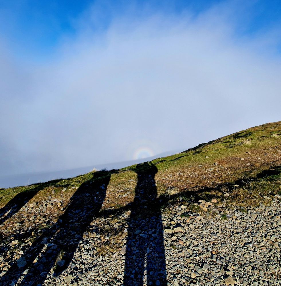 Three shadows and a brocken spectre, a halo / light phenomenon 