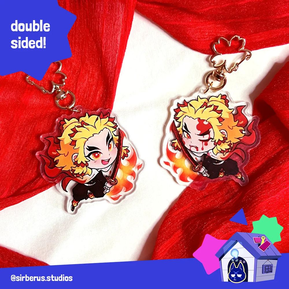 Photo of the Rengoku acrylic charm showing the two sides, the front side is the default chibi and on the reverse side shows injuries.  Top left text says "double sided!" and bottom right corner is a graphic indicating the artist is B2. 