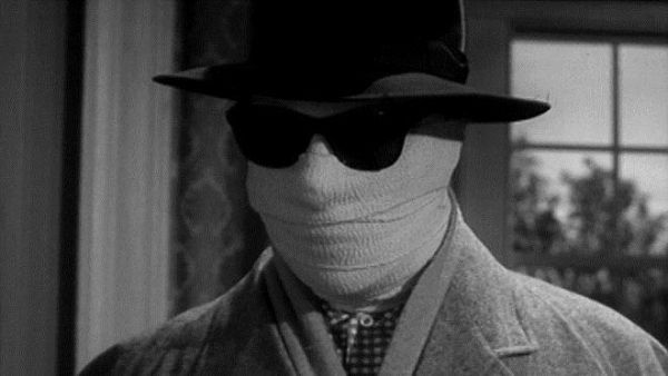 The Invisible Man, his head wrapped in bandages. 