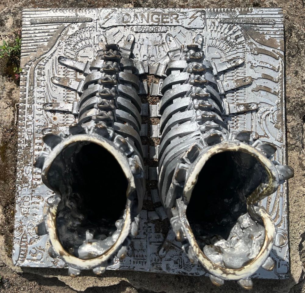 HR Giger metal sculpture “Sabotage” top view showing the openings where you can slip your feet… on your own risk.