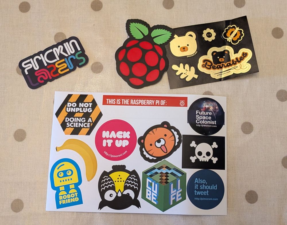 Selection of stickers including a Raspberry Pi logo, Bearables, Frickin Lasers and various maker, science and STEM stickers.