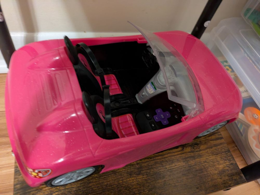 Barbie car with a tiny remote hidden in the seat well