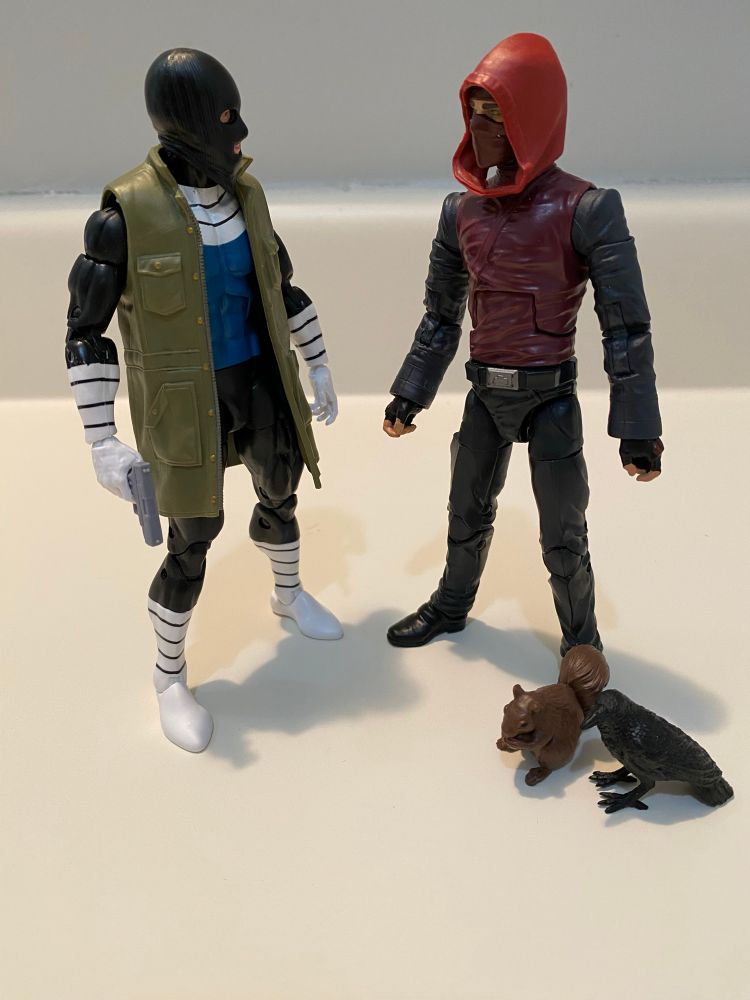 Protector: “Thanks for the assist there. I’ve taken him on before. Or maybe that was the previous Protector. It’s all a blur.”
Dex: “No prob. That felt oddly therapeutic for me.”
Protector: “I’m gonna put an end to that sick freak.”
Dex: “If you don’t mind me asking, I know this Rictus guy is here because of the whole worlds colliding thing. But what’s his deal anyway?”
Protector: “Fucked up stalker freak. He was obsessed with the original Protector. Loved harassing him and especially targeting Protector I’s wife. Basically an agent of chaos.”
Dex: “Sounds like a real piece of work”
Protector: “Oh he is. And that’s why when I find my other gun, I’ll blast his eyes out of his sockets again!”