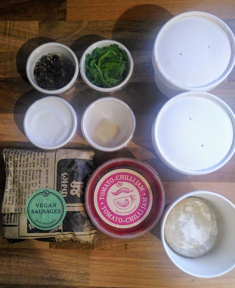 The Vegan Sausage Naan & Masala Chai Meal Kit from Dishoom - chai spices, coriander, cream cheese, ginger, pack of four vegan sausages, tomato & chilli jam (a house recipe, made with tomato, ginger, garlic, green chilli, rice vinegar and sugar), and three naan doughballs