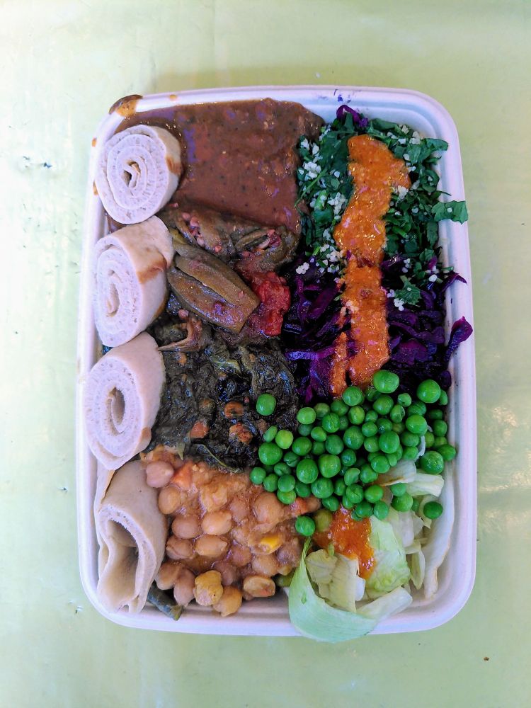 House Special from Ethiopiques -
Injera, Mittin Shiro, Gomen Wet, Mesir Wet, Chickpeas, Okra, Salad, Cabbage, Peas and Broad beans