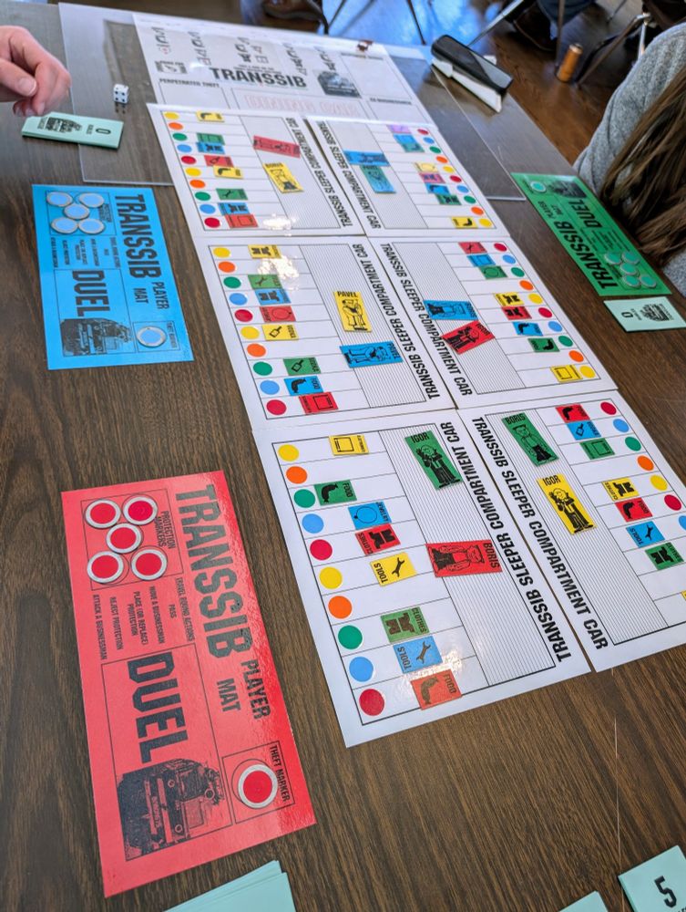 Transsib board game. The board and player sheets, metal washers for tokens.