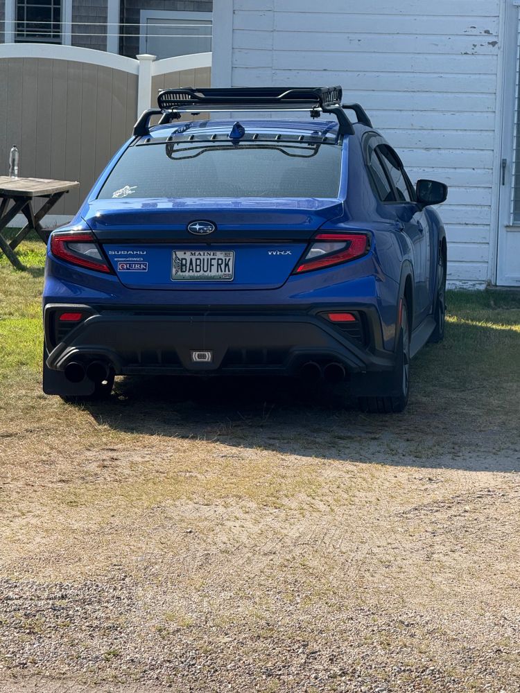 Picture of a blue Subaru WRX with a Maine license plate reading BABUFRK