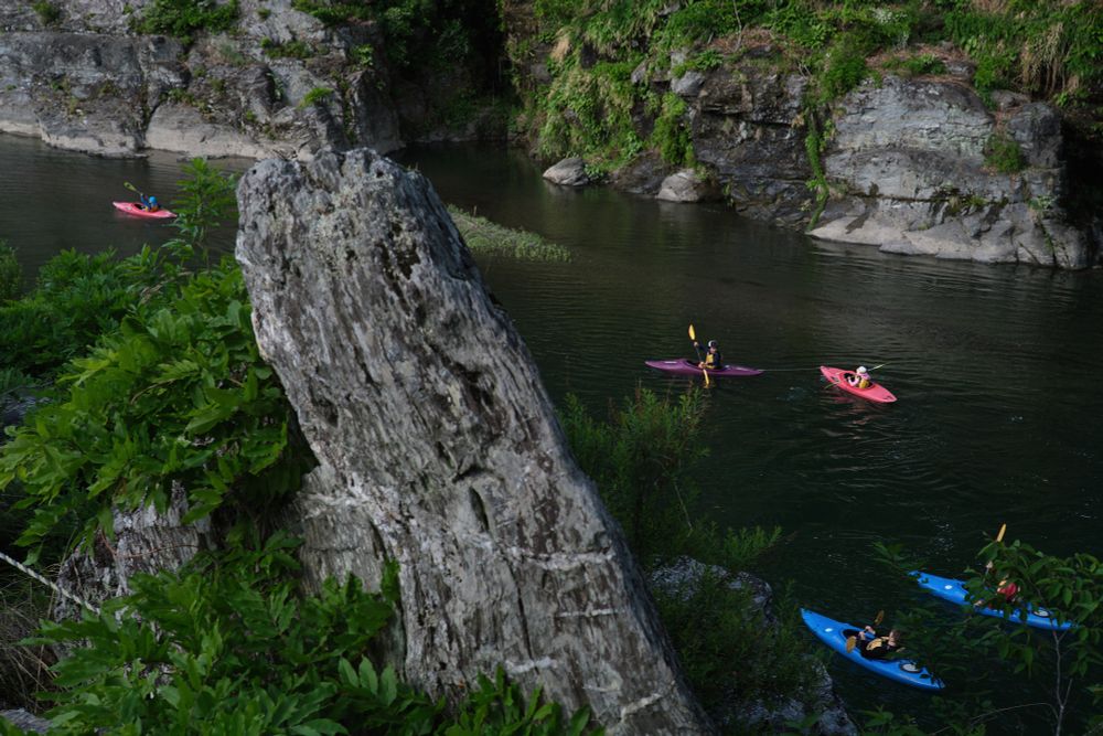 Kayaks moving along a river in Chichibu, Saitama