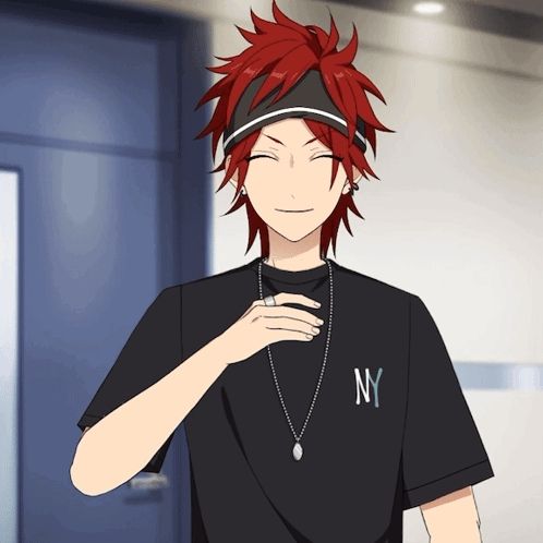 a man with red hair wearing a black ny shirt