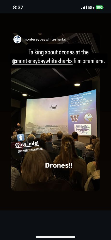 Me speaking in front of an audience at the Monterey Bay Sanctuary center about how our drone program supports studies of white sharks. 