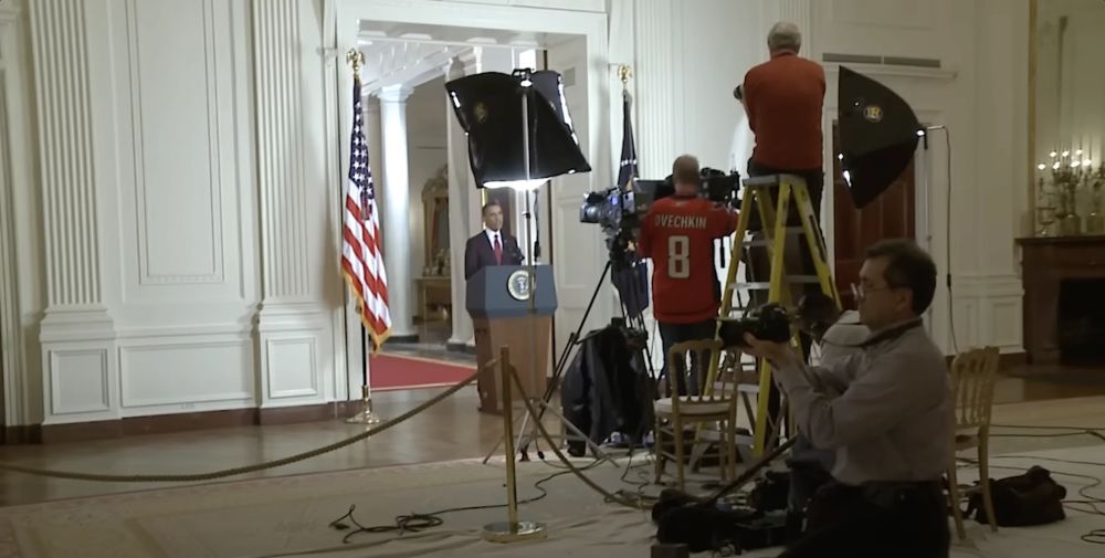 Behind the scenes footage of a cameraman in an Alex Ovechkin Washington Capitals filming President Barack Obama's address announcing the NAVY SEAL killing of Osama Bin Laden, May 1, 2011
