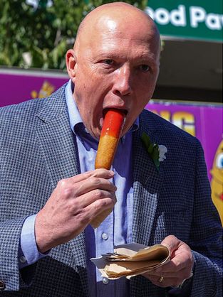 It's the former Australian opposition leader tucking into a Dagwood dog.