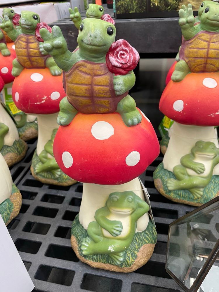 Lawn figures - turtle peace sign, on topof frog with sassy frog in the bottom 