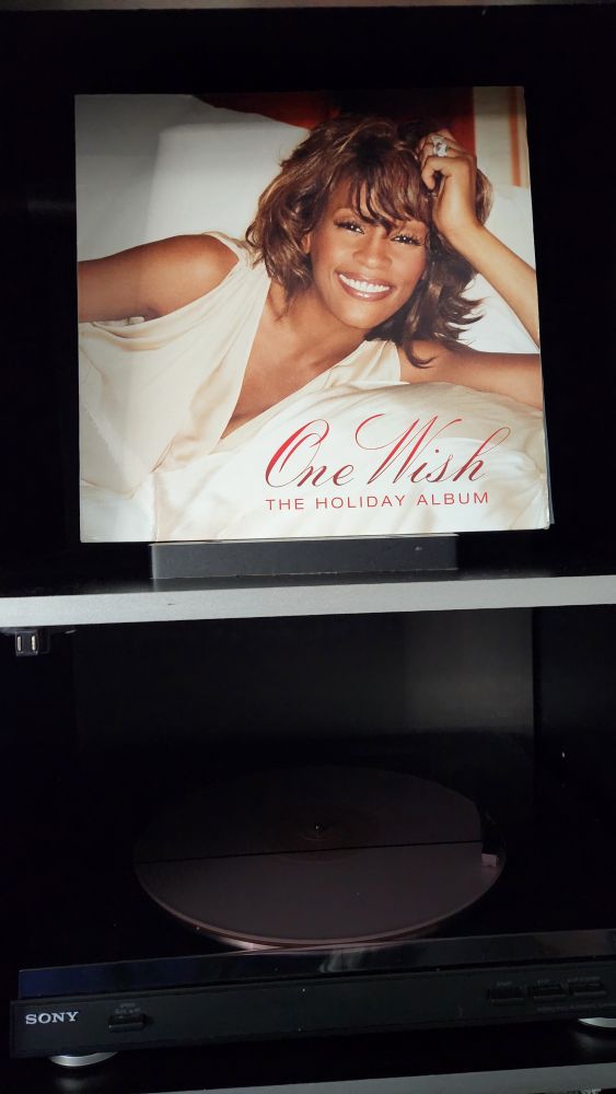 Whitney Houston One Wish The Holiday Album LP album cover featuring Whitney smiling