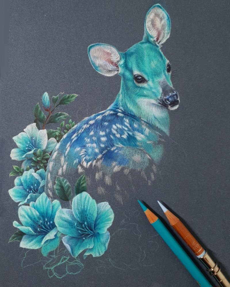 Drawing of a blue and turquoise fawn laying on a flower bed.