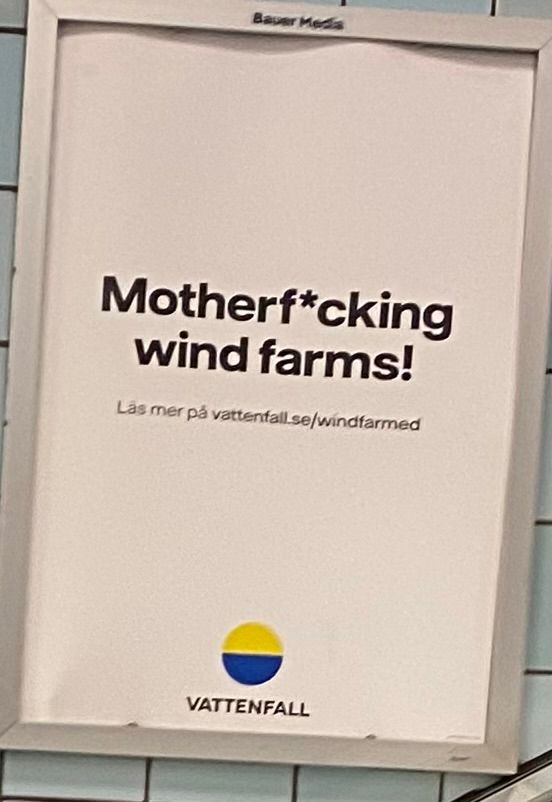 A poster with the caption “Motherf*cling wind farms!”