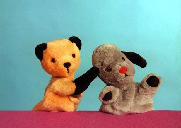 Sooty pulling the ear of Sweep