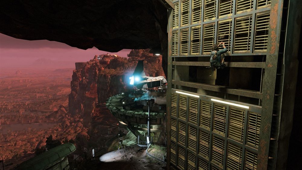 Hanging on the side of a sheet wall whilst an imperial shuttle flies onto a landing pad in the valley below