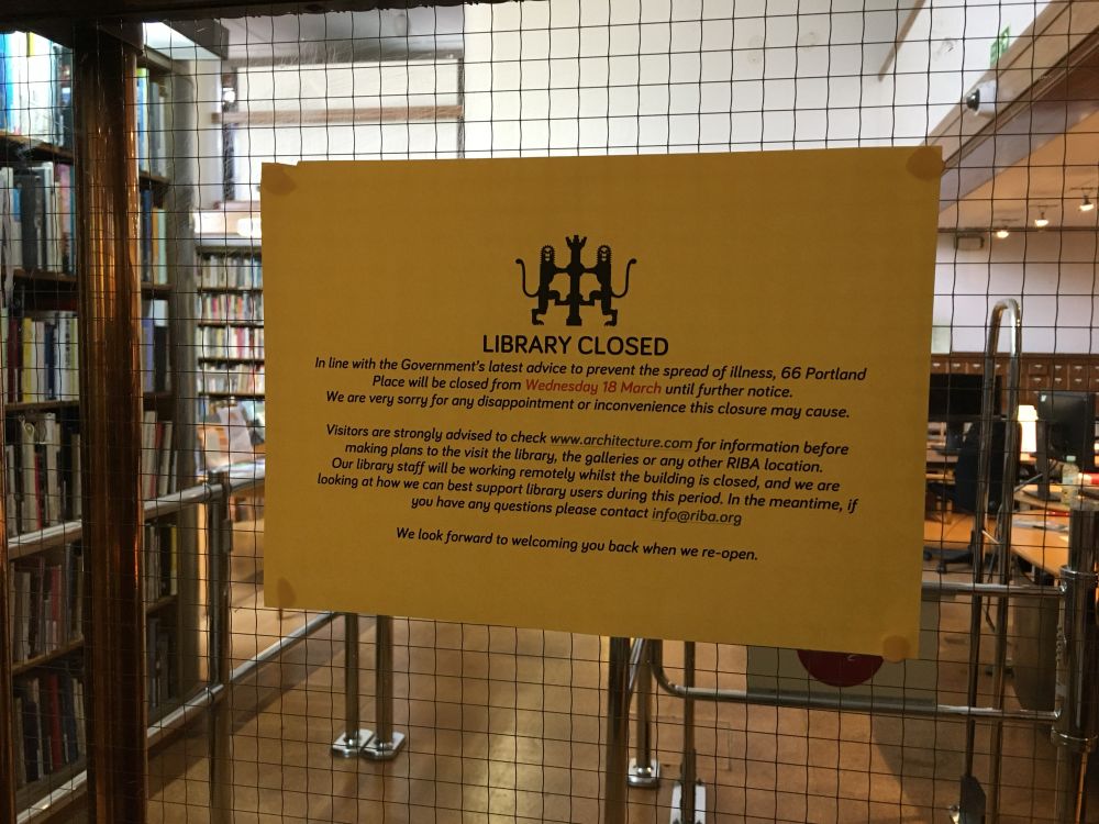 Notice on glass door panel informing users of closure of RIBA Library due to covid
