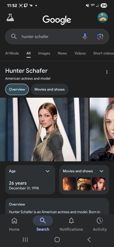 Hunter Schafer with a middle part and ears out. She looks like Zelda idk how else to describe it bro.