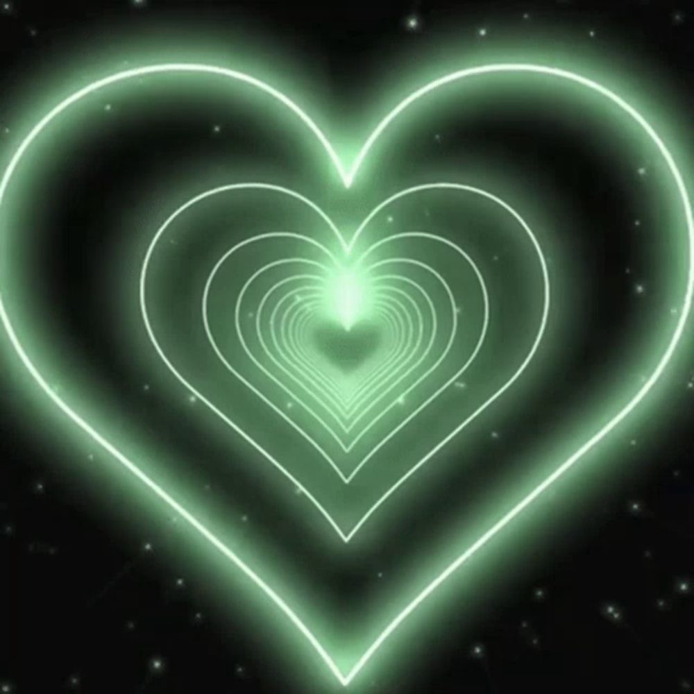 a green heart is surrounded by other hearts