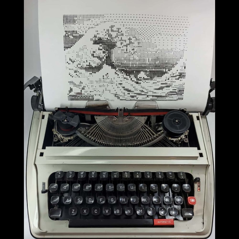 An image of a thunderously crashing wave, a masterclass of the use of positive and negative space, sits in the typewriter in which its typographical picture elements were individually typed.