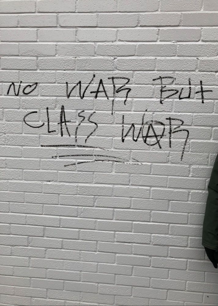 Writing on a wall saying 'No War but Class War'