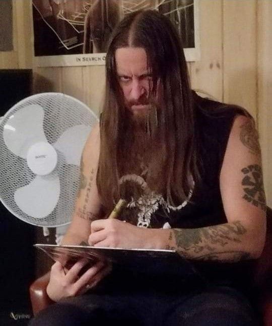 Fenriz of Darkthrone autographing a record