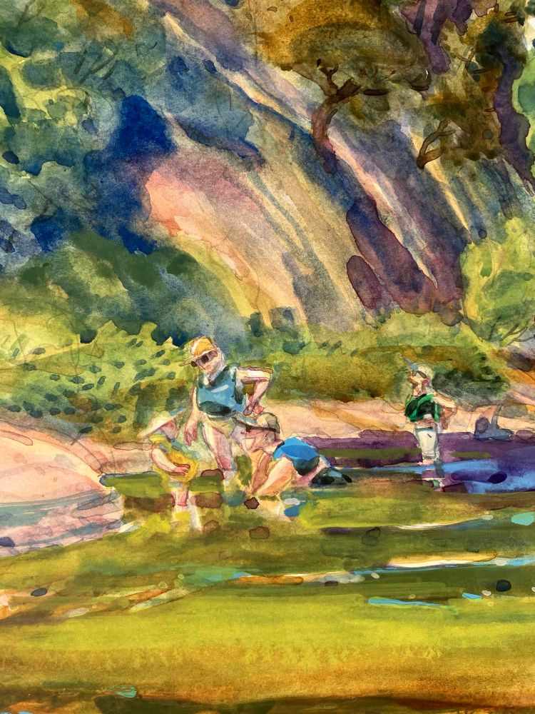 A close up of the people in the river. Easier to see the grin here. The toddler is just staring at him. 